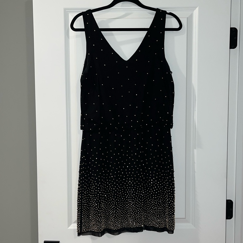 Black mini dress with gold detail